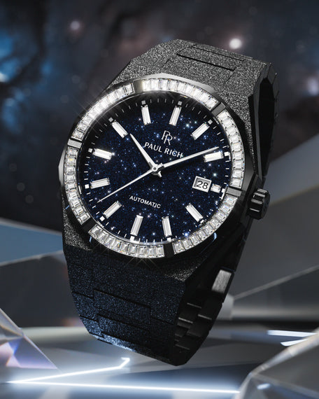 Black Paul Rich watch with frosted texture, blue aventurine dial, and gem-set bezel, displayed against a cosmic-inspired background.