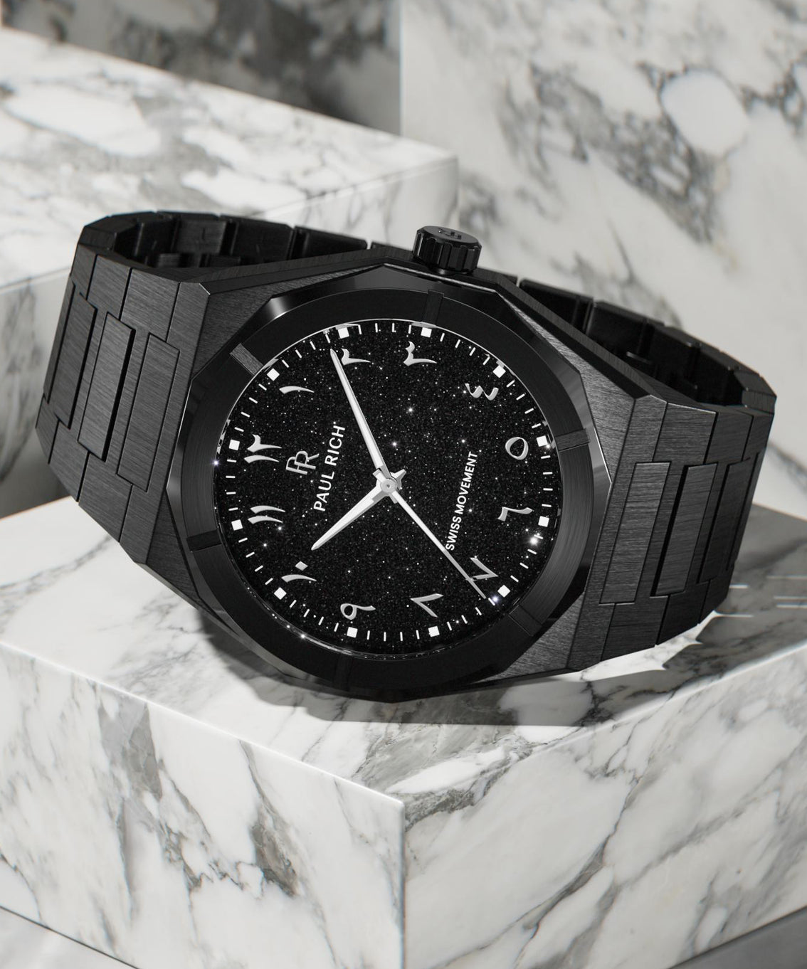 Paul Rich black brushed watch with black aventurine dial, silver Eastern Arabic numerals, and Swiss movement on black bracelet.