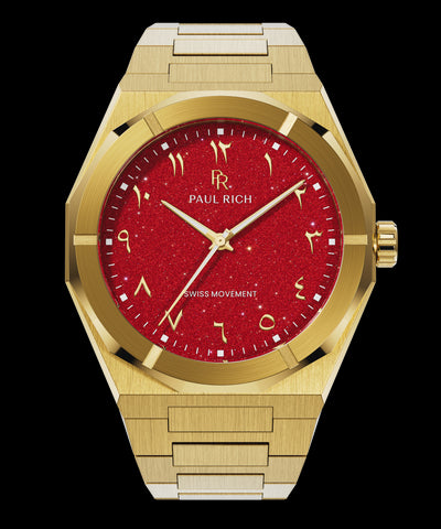 Paul Rich watch with brushed gold case and bracelet, featuring a red aventurine dial with Arabic numerals and gold hands.