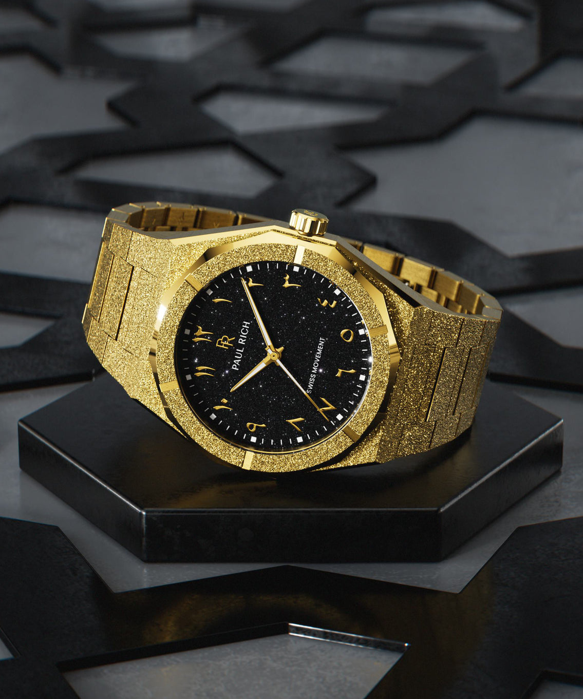 Paul Rich gold frosted watch with black aventurine dial and gold Eastern Arabic numerals, displayed on geometric black base.
