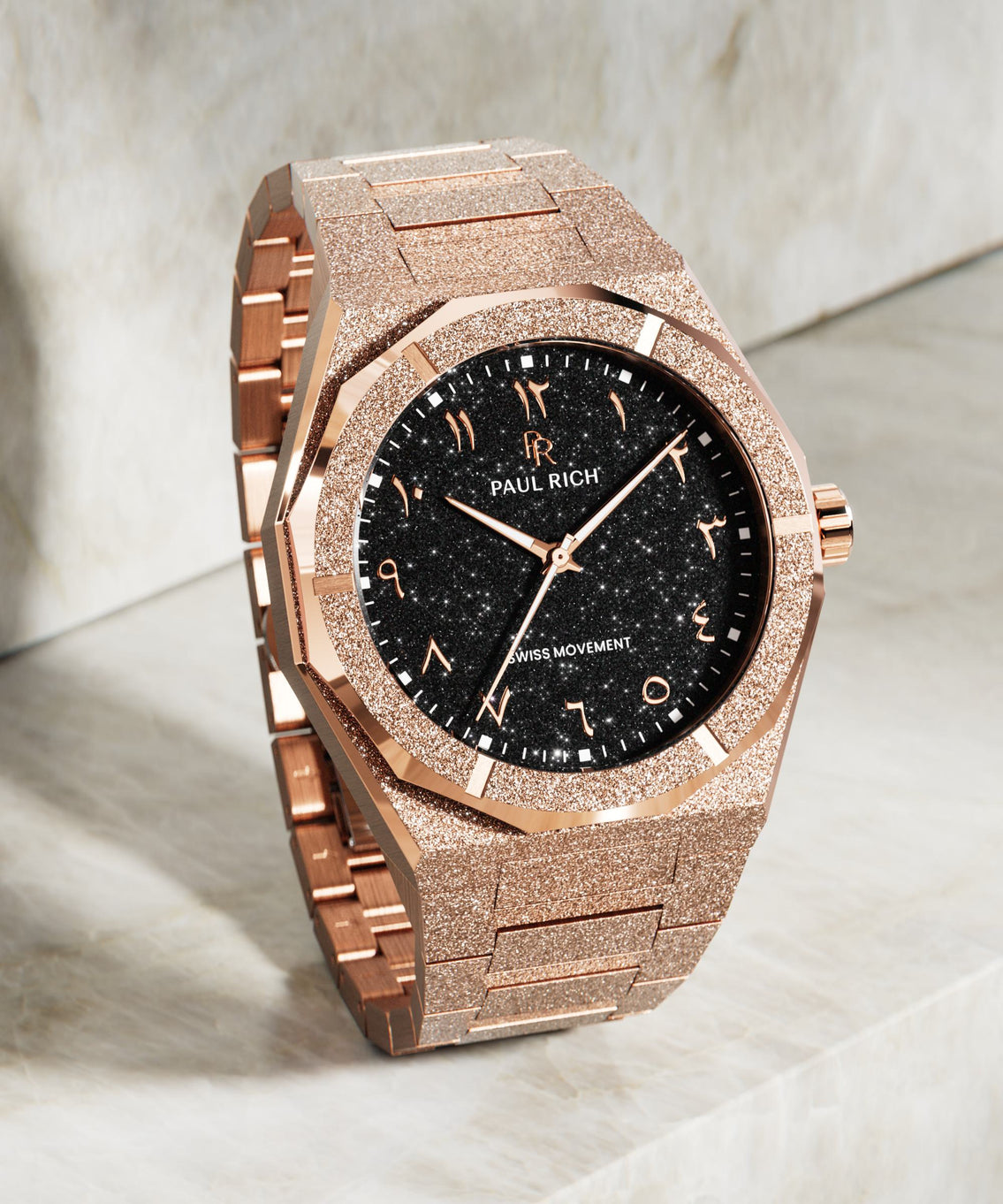 Paul Rich rose gold frosted watch with black aventurine dial, rose gold Eastern Arabic numerals, and Swiss movement.