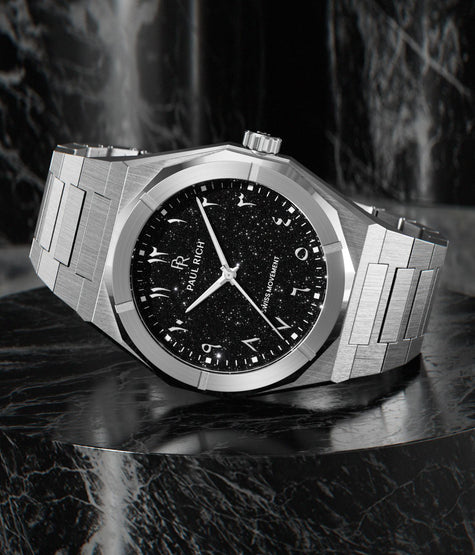 Paul Rich brushed steel watch with black aventurine dial, silver Eastern Arabic numerals, and Swiss movement on steel bracelet.
