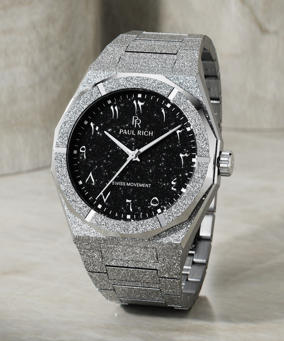 Paul Rich silver frosted watch with black aventurine dial, silver Eastern Arabic numerals, and Swiss movement on bracelet.