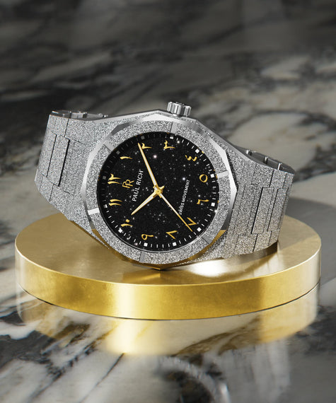 Paul Rich silver frosted watch with black aventurine dial, gold Eastern Arabic numerals, and Swiss movement on silver bracelet.