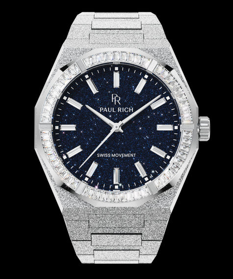 Silver frosted watch with blue aventurine dial and trapezoid-cut moissanite bezel, reflecting crisp white light across its polished surface.