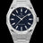 Silver frosted watch with blue aventurine dial and trapezoid-cut moissanite bezel, reflecting crisp white light across its polished surface.