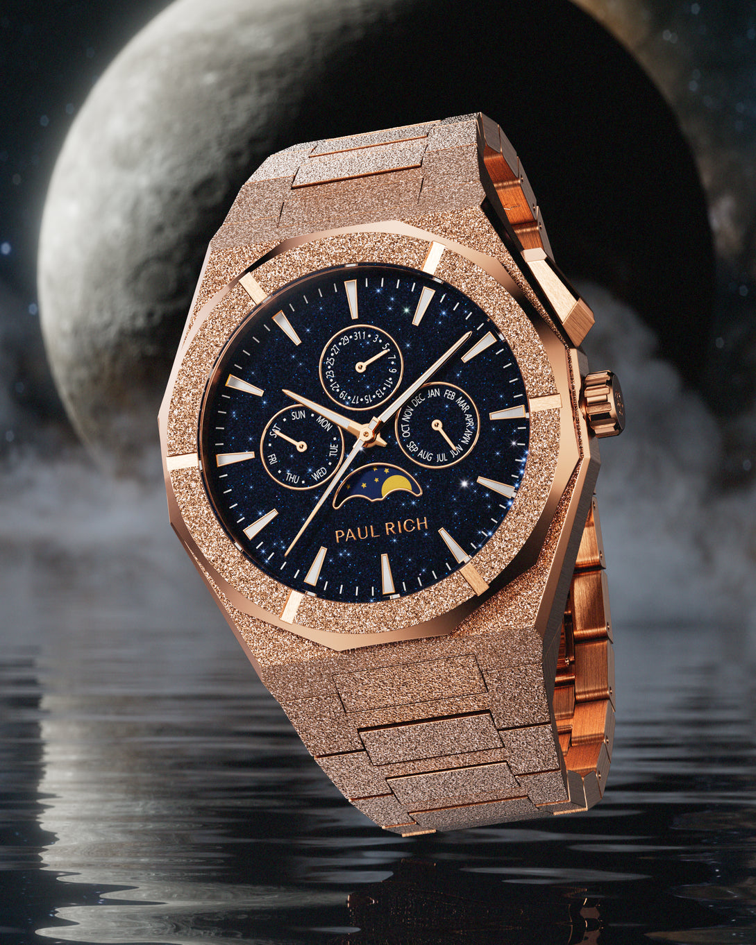 Frosted rose gold-tone stainless steel watch with blue aventurine dial, moonphase, and subdials, set against a dramatic moonlit water scene.