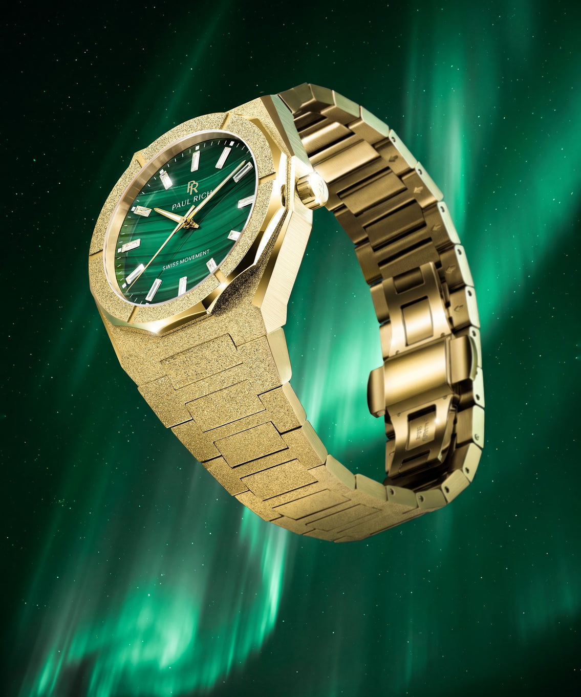 Frosted Star Dust II Malachite Aurora Gold, angled view with the bracelet closed, under the northern lights