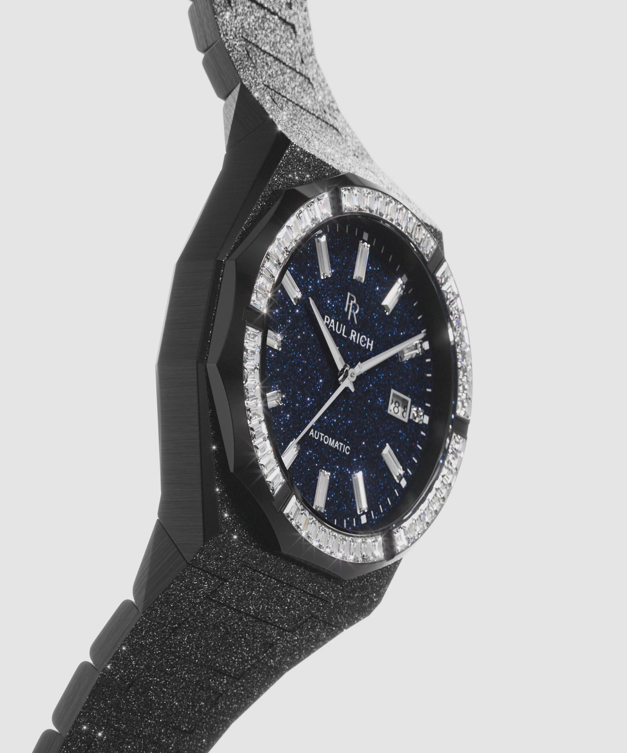 Black frosted watch with a blue dial and stone-set bezel, shown from the side