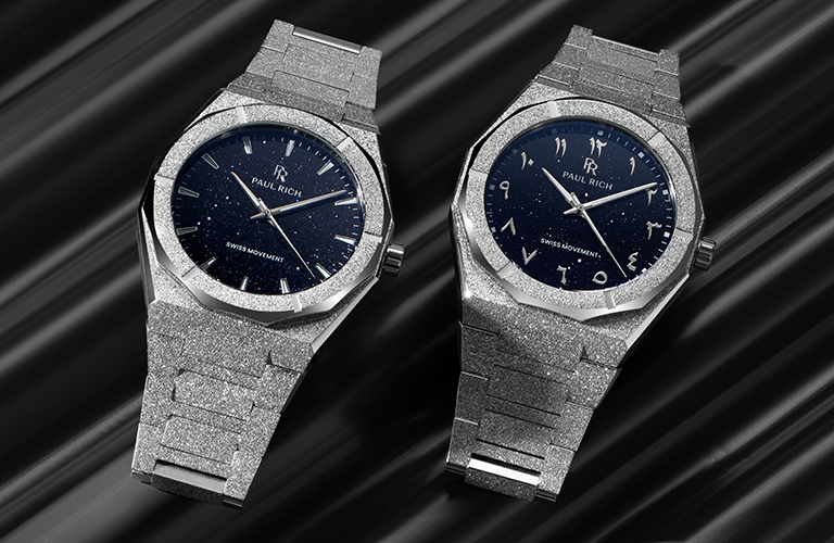 Four MoissaniFrosted Star Dust II watches in black, silver, gold, and rose gold, displayed on reflective crystal surfaces.